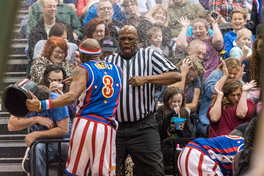 "Firefly" soaks a referee and crowd with a bucket of water after not having the call go his way. (Nickolas Oatley/WOUB)