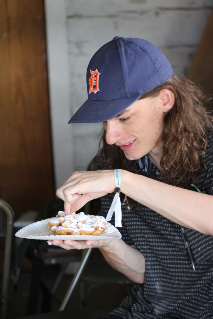 WOUB's intrepid reporter, Hiatt Hernon, enjoying a funnel cake. (WOUB/Marie Swartz)