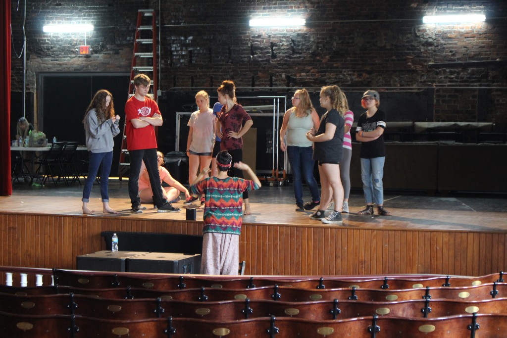 Students work on an elaborate rendition of "Cotton Eyed Joe" on stage at Stuart's Opera House. (WOUB/Emily Votaw) 