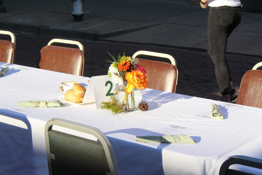 A close up of a flower arrangement on one of the tables in this year's Bounty on the Bricks. (WOUB/Emily Votaw) 