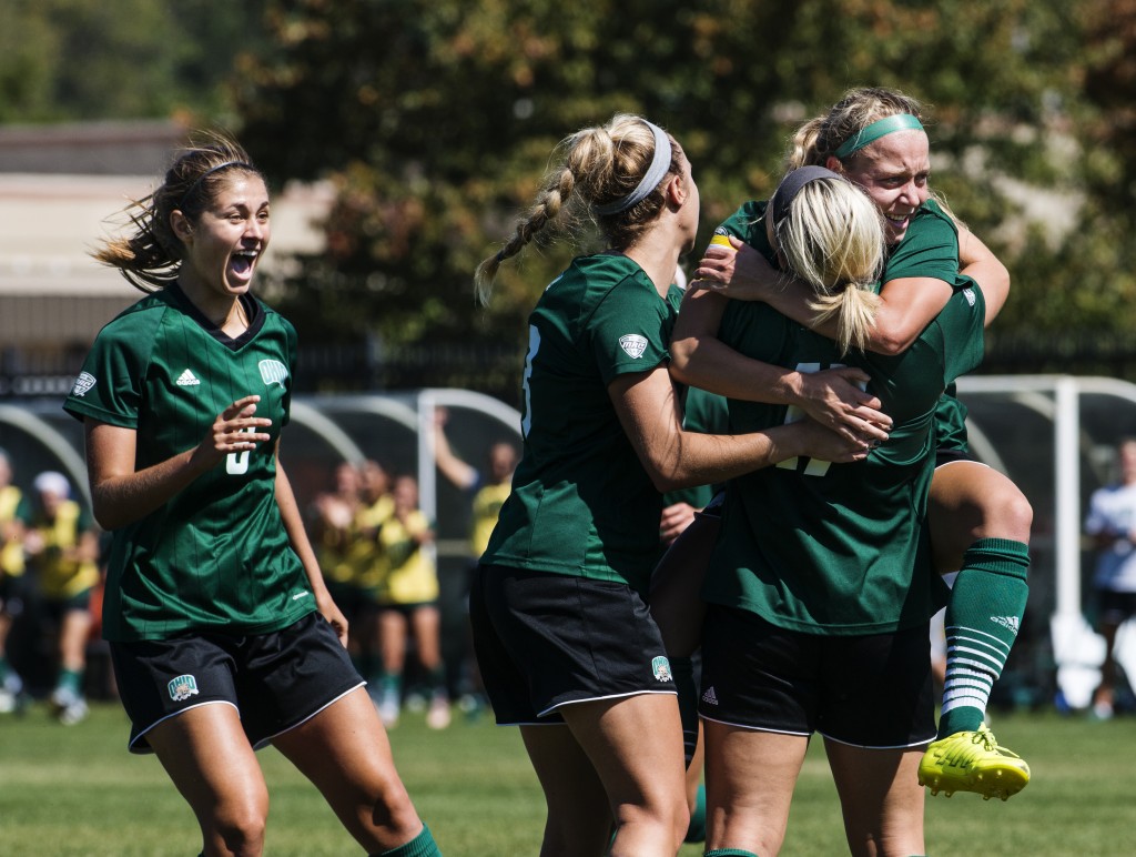 Bobcats teammates hug and celebrate after the first goal is scored during their game against Central Michigan on September 24, 2017 in Athens, Ohio. The Bobcats won the game 3-0. (Kelsey Brunner/WOUB)
