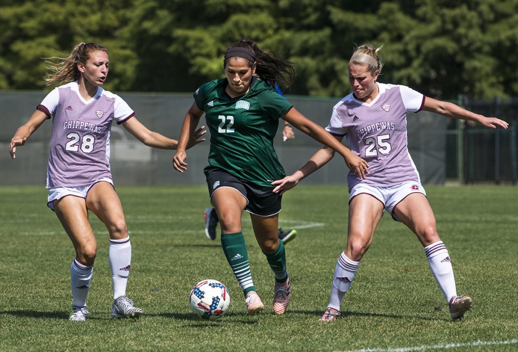 Ohio's midfielder Sarina Dirrig pushes past Central Michigan's defenders Ally Viazanko, left, and Savannah Beetcher during their game on September 24, 2017 in Athens, Ohio. (Kelsey Brunner/WOUB)