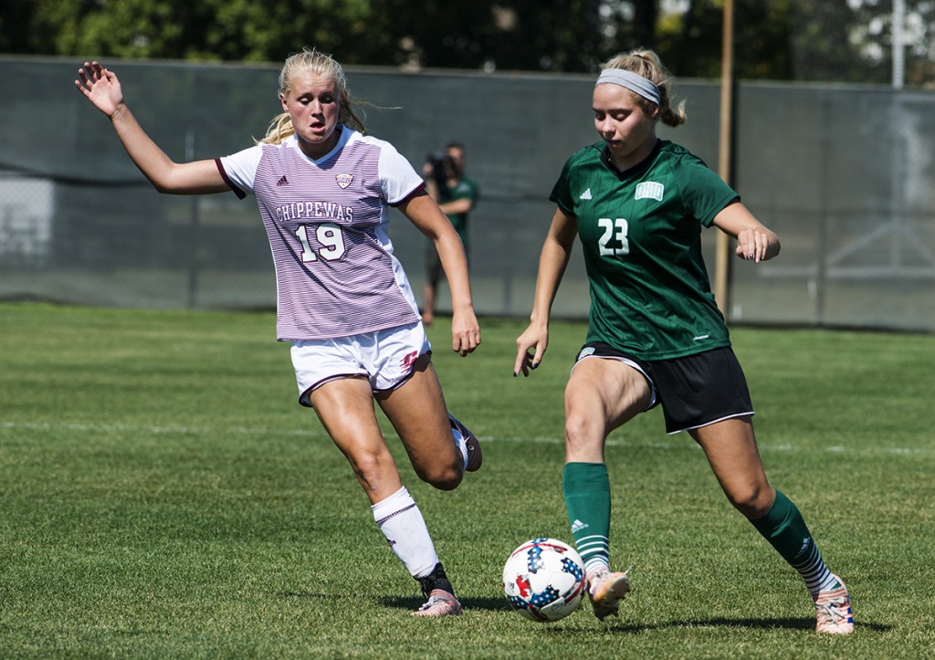 Central Michigan's Haddie Carlson, left, pursues Ohio's Courtney Daugerdas during their game on September 24, 2017 in Athens, Ohio.