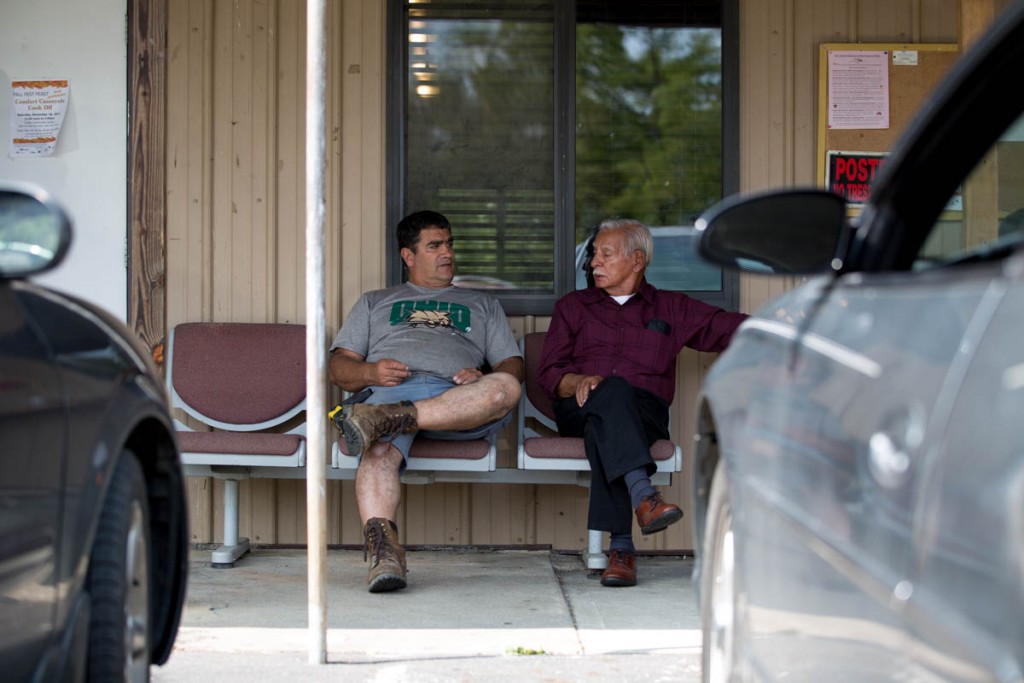 Patrick Thomas, left, and Cecil Tabler sit outside the Kilvert Community Center in Kilvert, Ohio, on September 17, 2017. Tabler is one of the descendants of town founder Michael Tabler. (Haldan Kirsch/WOUB)