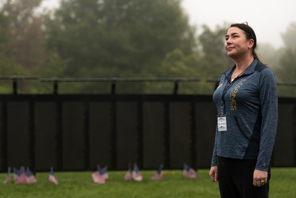 Stephanie Albert, from Lancaster, Pennsylvania, poses for a portrait in front of the Vietnam Veterans Memorial. Stephanie was active in the Marines from 1993-1997, while her father served in the Army, her sister was in the Navy, her grandfather was in the Marine Core and her grandmother was also in the Navy. The legacy of this family's constant strive to fight for freedom started when Stephanie's grandparents first met at Pearl Harbor. "Freedom is important to us, America is important to us and I feel bad for people who don't have the luxury that we have," says Stephanie. (Nickolas Oatley/WOUB)
