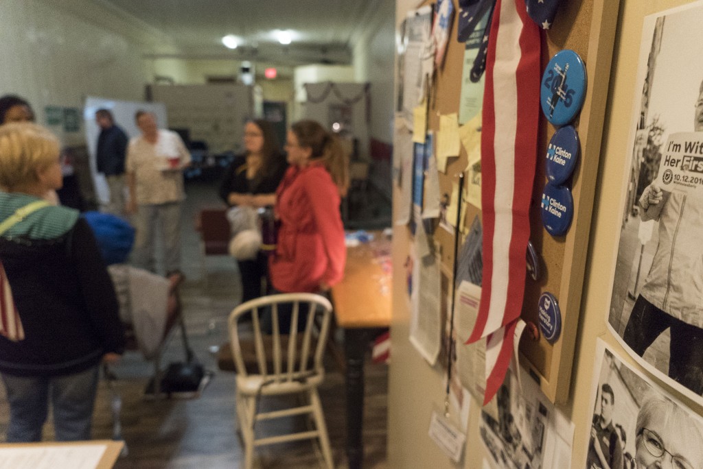 Attendees at the Athens County Democratic Party gubernatorial debate watch party talk about what candidate they enjoyed the most at the conclusion of the first debate. (Austin Janning/WOUB)