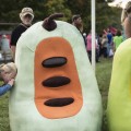 Chloe Kunkel,12, looks inside the pawpaw fruit costume in PawPaw festival in Albany, Ohio on Sep. 16, 2017.