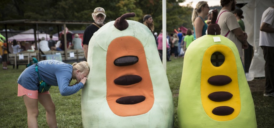 Chloe Kunkel,12, looks inside the pawpaw fruit costume in PawPaw festival in Albany, Ohio on Sep. 16, 2017.