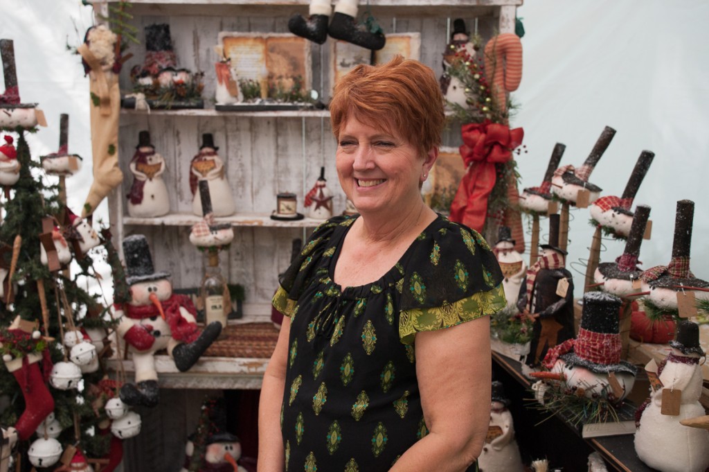 Beverly Fast, from Lima, Ohio, displays a collection of her seasonal crafts at the Backwoods Fest in Thornville, Ohio.