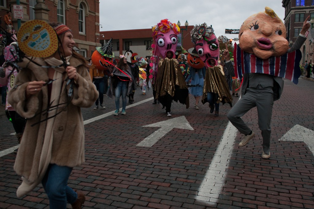 Community members and students participate in the Honey for the Heart parade on Court Street in Athens, Ohio. (Michael Johnson/WOUB)