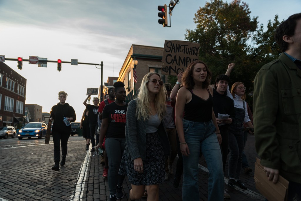 Protestors make their way down Court Street and over to campus. (Nickolas Oatley/WOUB)