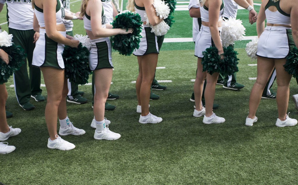 Ohio University cheerleaders line up to exit the stadium after completing their warm-up exercises before Ohio University's homecoming football game against Central Michigan on Saturday. (Austin Janning/WOUB)