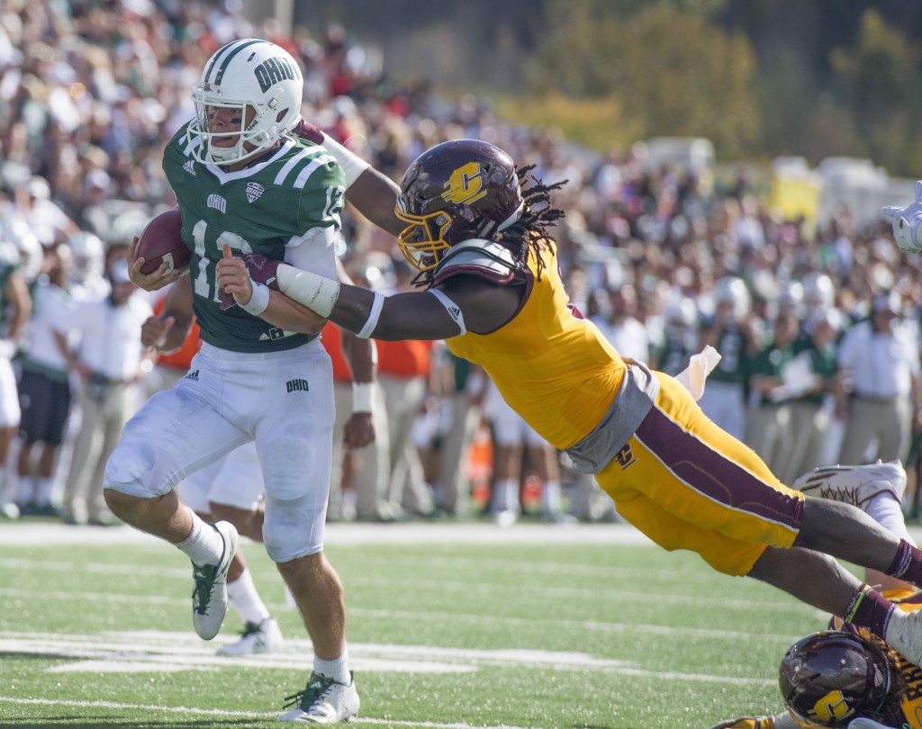 Ohio quarterback Nathan Rourke (12) breaks a tackle during Ohio University's homecoming football game against Central Michigan on Saturday. (Austin Janning/WOUB)