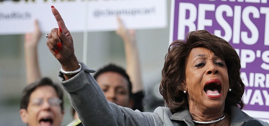 Rep. Maxine Waters, D-Calif., addresses a rally against the Republican tax plan outside the U.S. Capitol on Nov. 1. An analysis of the House and Senate proposals show they are likely to benefit the wealthy more than lower-income Americans.