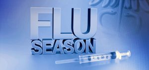 A flu season graphic with a syringe