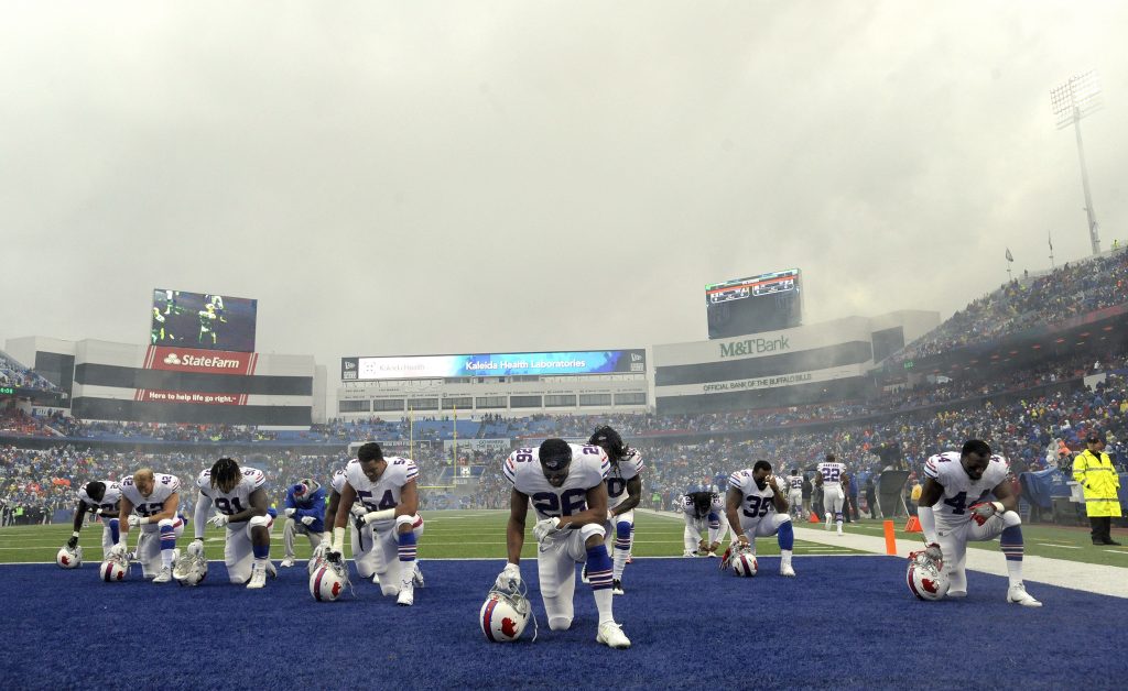 Buffalo Bills players take a moment to themselves prior to an NFL football game in Orchard Park, N.Y., on Oct. 29.