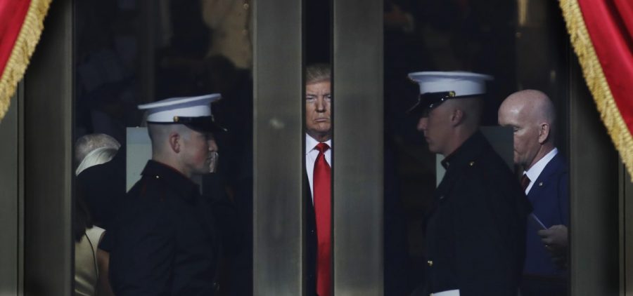 Donald Trump waits to step onto the portico for his presidential inauguration on Jan. 20.