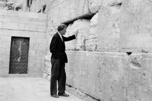 Graham stands by the Western Wall in Jerusalem on March 17, 1960. Graham was on an 18,000-mile preaching tour of Africa and the Middle East.
