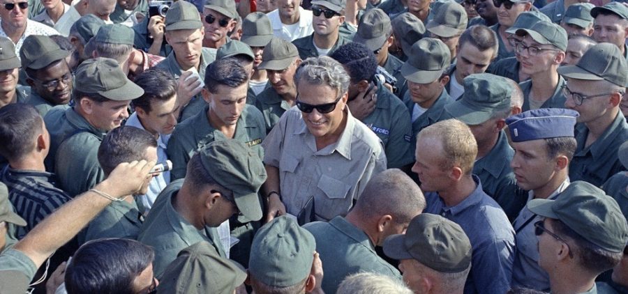 American servicemen in Vietnam greet Graham during a Christmas visit with troops on Dec. 21, 1966.