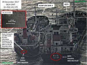 In this photo released by the U.S. Treasury Department, the North Korean vessel KUM UN SAN 3 (left) conducts a ship-to-ship transfer with the Panama-flagged KOTI on Dec. 9. The Treasury Department, which announced new sanctions on Friday, says this transfer shows North Korea's efforts to evade sanctions.