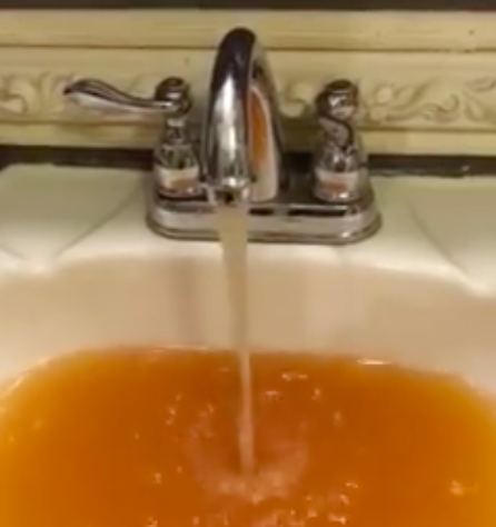A still image from a video of foul water in a Martin County home. 
