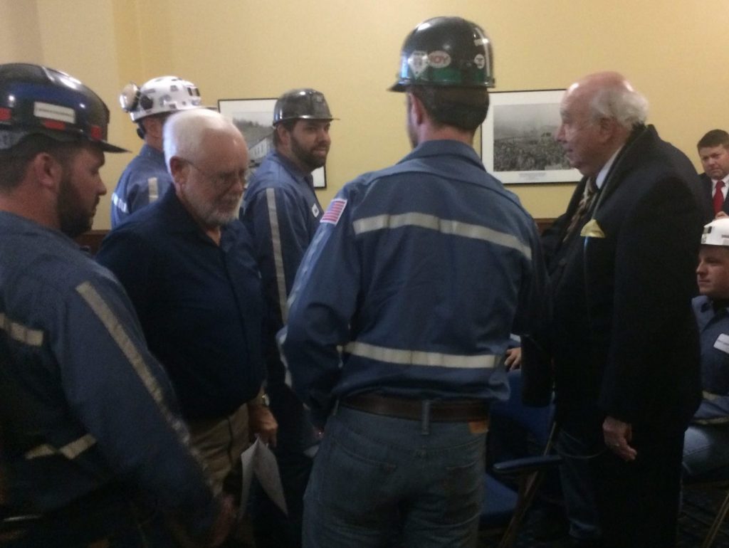 Murray Energy CEO Bob Murray, right, greets miners.