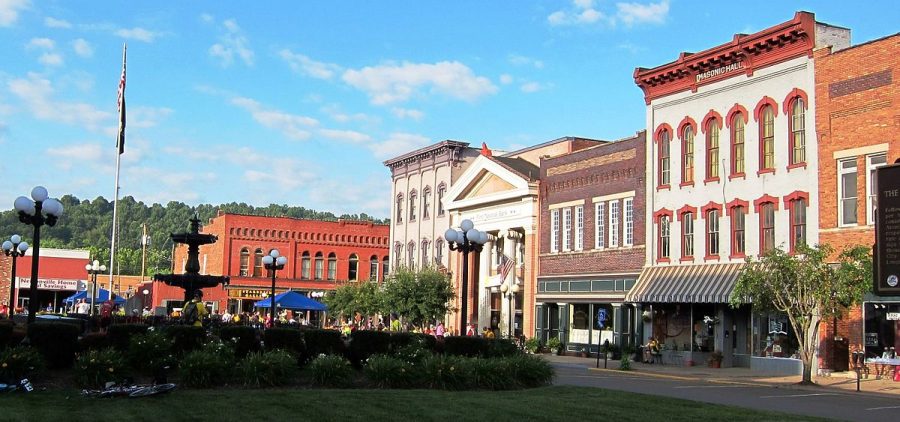 Photo of town square in Nelsonville Ohio. The town's fountain in on the left hand side of the image with buildings on the right.