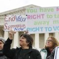 People rally outside of the Supreme Court in opposition to Ohio's voter roll purges in January. The court upheld the controversial law Monday.