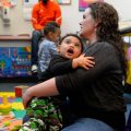 Kelly Zimmerman holds her son Jaxton Wright at a parenting session at the Children's Health Center in Reading, Pa. The free program provides resources and social support to new parents in recovery from addiction, or who are otherwise vulnerable.