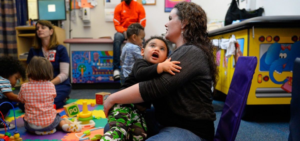 Kelly Zimmerman holds her son Jaxton Wright at a parenting session at the Children's Health Center in Reading, Pa. The free program provides resources and social support to new parents in recovery from addiction, or who are otherwise vulnerable.