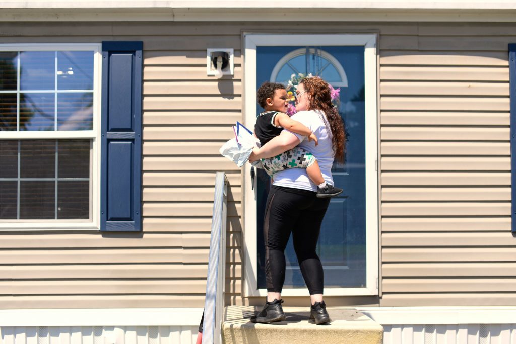 Kelly Zimmerman holds her son, Jaxton, outside their home in Douglassville, Pa. Kelly moved in with her parents before Jaxton's birth; the baby's father died in July of 2016 from a heart attack.