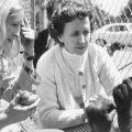 Koko, the gorilla who became an ambassador to the human world through her ability to communicate, has died. She's seen here at age 4, telling psychologist Francine "Penny" Patterson (left) that she is hungry. In the center is June Monroe, an interpreter for the deaf at St. Luke's Church, who helped teach Koko.