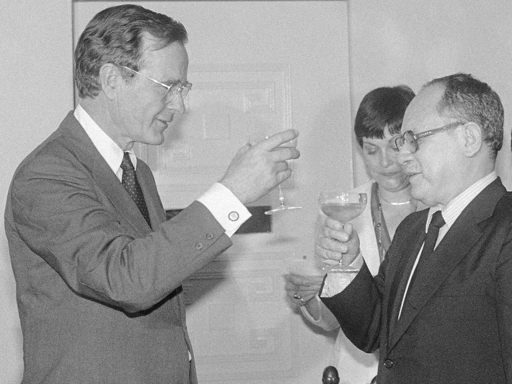 Former Vice President George H.W. Bush met with El Salvador's President Ãlvaro Magaña in 1983. During the toast, Bush relayed President Ronald Reagan's concern over killings by right-wing death squads. Stephanie Van Reigersberg (center) was Bush's interpreter.