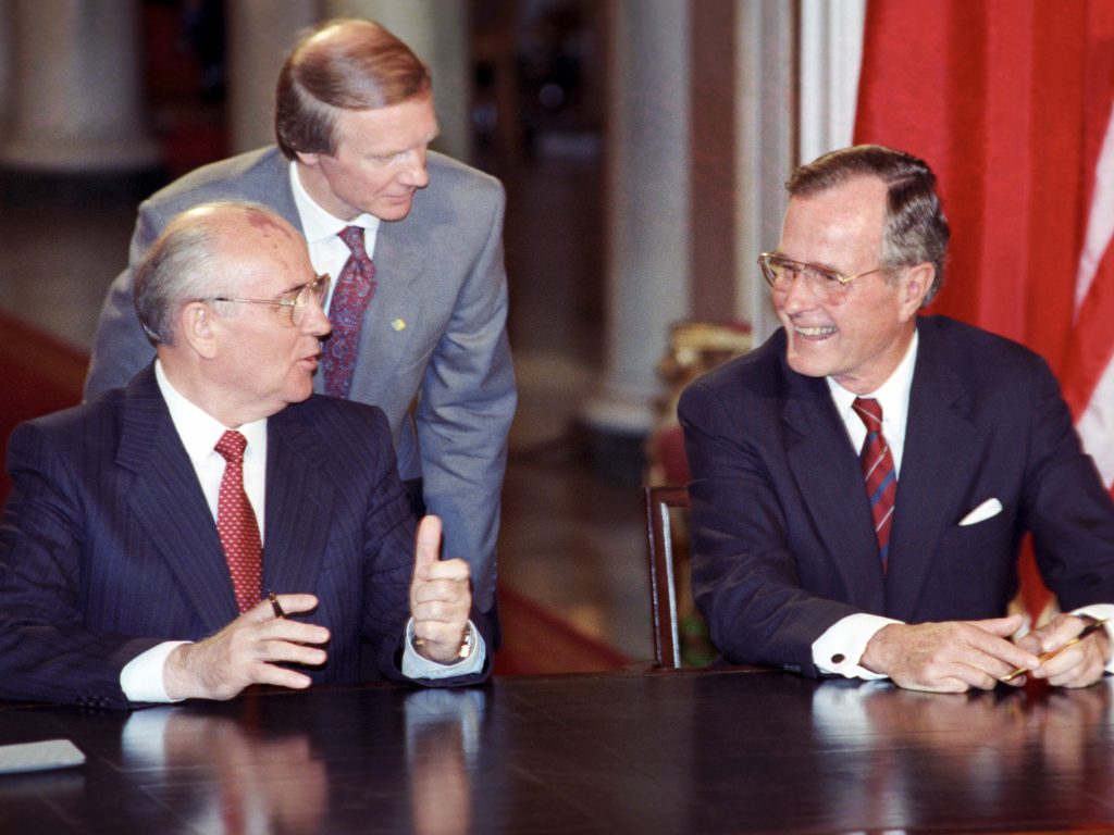Igor Korchilov (center) served as interpreter when Soviet leader Mikhail Gorbachev and President George H.W. Bush met in 1990 to discuss arms control.