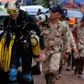 British cave-diver John Volanthen walks out of the flooded Tham Luang cave on Thursday. Rescue teams in Thailand have been working around the clock to save 12 boys and their soccer coach who went missing Saturday evening.
