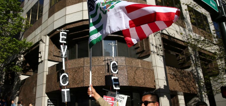 A former top attorney at ICE in Washington state has pleaded guilty to stealing the personal information of immigrants who were at risk of deportation, and using the data to defraud banks. Here, protesters stand outside the ICE office in Seattle during a demonstration in May.