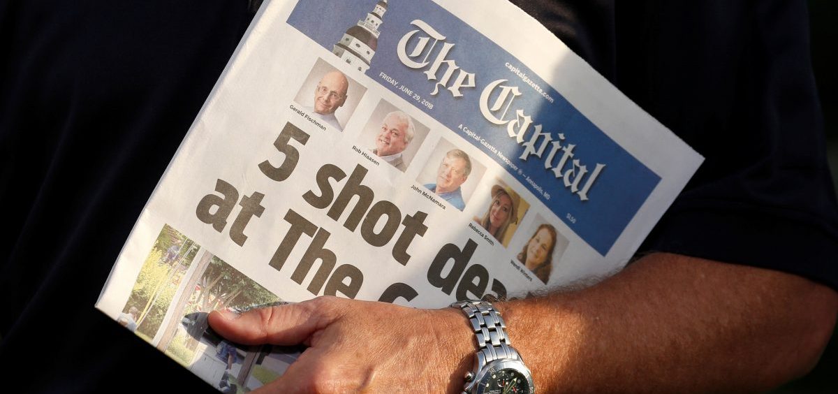 Steve Schuh, county executive of Anne Arundel County, Md., holds a copy of Friday's The Capital.