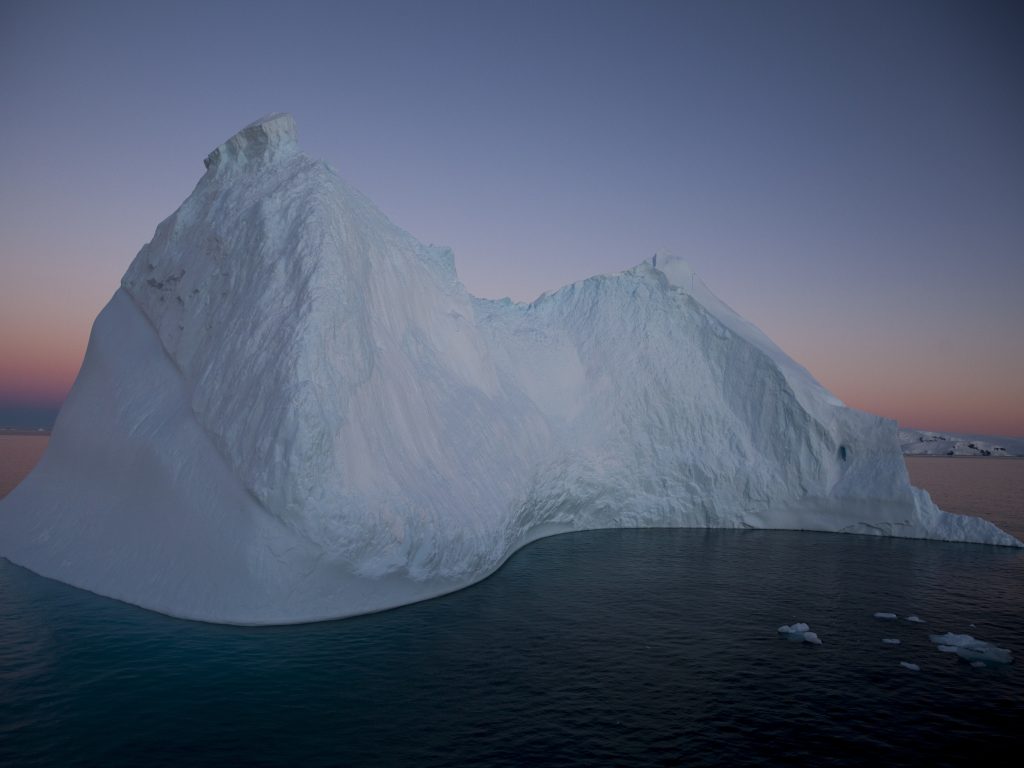 Icebergs mark the approach to the Antarctic Peninsula. Trying to catch the predawn light means being on deck well before the 3:15 a.m. sunrise, when subtler hues bathe the ice forms.
