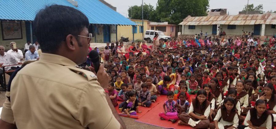Harssh Poddar, a senior police official, addresses a village meeting at a rural school near Malegaon, in northern Maharashtra state. He warns families to be skeptical of what they read online. Earlier this month, Poddar helped rescue five people from being killed by a mob in his constituency.