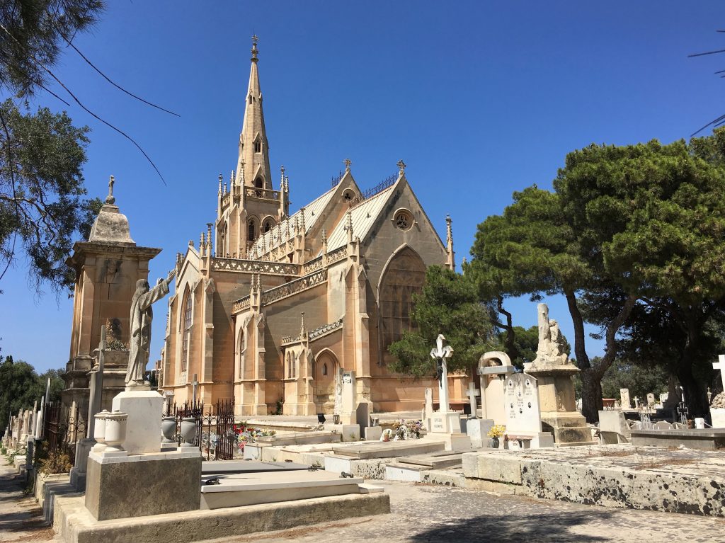 The neo-gothic Chapel of our Lady marks the center of Addolorata, Malta's main cemetery. Perched on a hilltop, the cemetery is covered with elaborate Catholic crypts and tombstones chiseled with the names of loved ones.