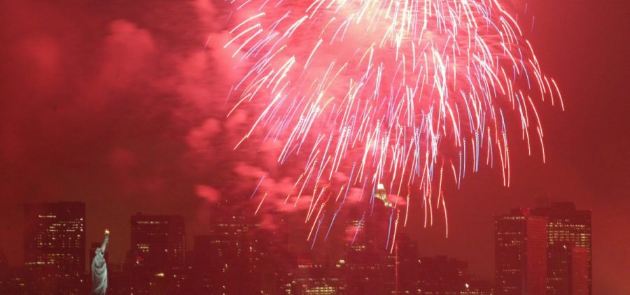 The sky surrounding the Statue of Liberty in New York is lit red by a firework in 2005. Nearly all the fireworks consumers will purchase this year — and 70 percent of those used by professionals — are manufactured in China.