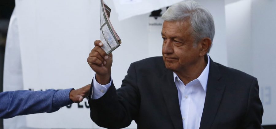Presidential candidate Andrés Manuel López Obrador, of the MORENA party, shows his ballot to the press before casting it during general elections in Mexico City on Sunday.