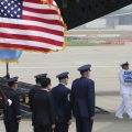 A U.N. honor guard at Osan Air Base in Pyeongtaek, South Korea, carries a box containing remains believed to be from American servicemen killed during the Korean War after they arrived from North Korea on Friday.