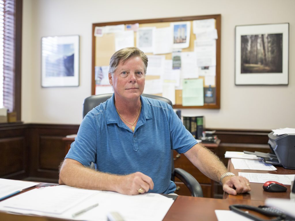 Michael Stevens, senior executive vice president of Vaughan Furniture Company, sits at his desk in Galax, Va. Following the decline of the furniture production industry in Galax, the Vaughan Furniture Company was forced to largely shut down. Now Stevens oversees the leasing of their facilities and office spaces to other companies as they try to sell their large properties in town.