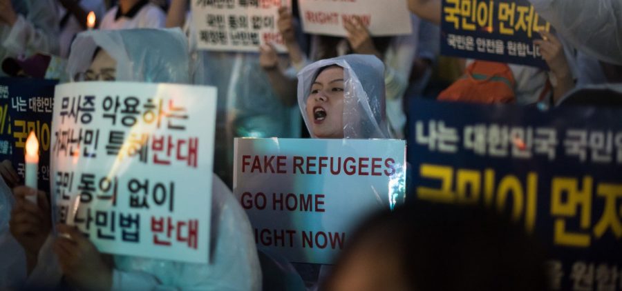 Protesters in Seoul demonstrate against a group of asylum seekers from Yemen, on June 30. Hundreds of asylum seekers from Yemen have arrived in South Korea's southern resort island of Jeju.