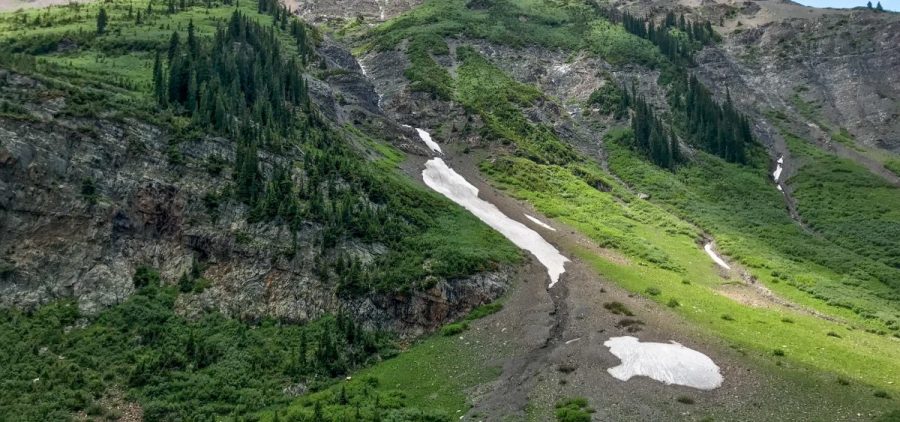 Slivers of snow still hide in coulees near Schofield Pass. A low winter snowpack and high spring temperatures melted most of winter's snow earlier than normal in Colorado's Rocky Mountains.