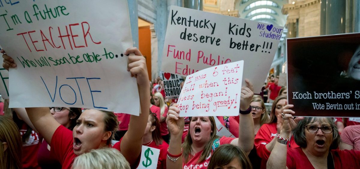 Teachers from across Kentucky gather inside the state Capitol to rally for increased funding for education, Friday, April 13, 2018, in Frankfort, Ky.