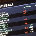 This Aug. 1 2018 photo shows a board at Harrah's casino in Atlantic City, N.J., listing the odds on pro football games in the first week of the NFL season. Resorts casino will begin taking sports bets in person on Wednesday, Aug. 15, becoming the fifth Atlantic City casino to do so.