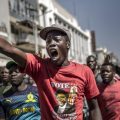 Supporters of the Movement for Democratic Change, Zimbabwe's primary opposition party, protest against alleged fraud by the election authority and ruling party Wednesday in Harare.