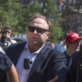 Alex Jones and his Infowars channels have been removed from YouTube; Facebook and Apple's iTunes have also deleted most or all of his outlets on their services. He's seen here being escorted from a rally near the 2016 Republican National Convention.